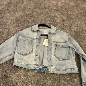 Slightly cropped Jean jacket. New with tags on. Worn once. Good material